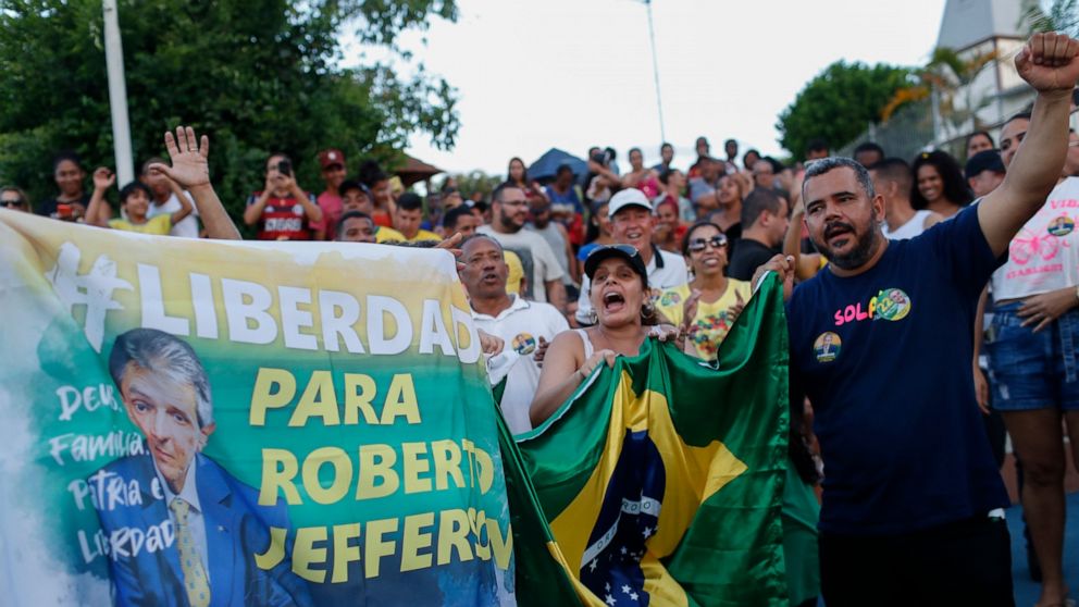 Supporters of former lawmaker Roberto Jefferson protest against his arrest next to his house in Levy Gasparian, Rio de Janeiro state, Brazil, Sunday, Oct. 23, 2022. Jefferson, an ally of Brazilian President Jair Bolsonaro, fired gunshots and a grenad