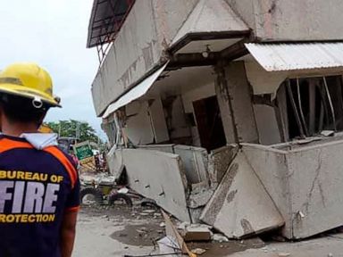 Rescuers search building rubble after Philippines quake