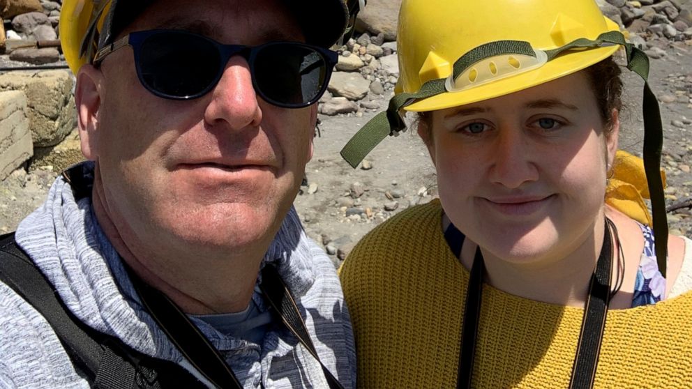 In this Monday, Dec. 9, 2019, photo provided by Lillani Hopkins, Lillani Hopkins pictured with her father Geoff prior to the eruption on White Island off the coast of Whakatane, New Zealand. Lillani Hopkins was feeling seasick and keeping her eyes tr