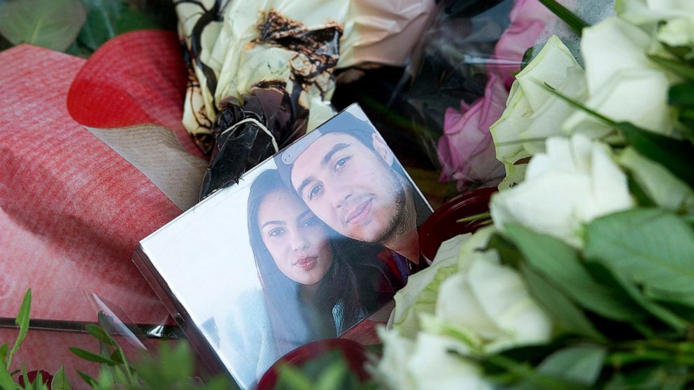 FILE - A picture of Bryce Fredriksz and his girlfriend Daisy Oehlers who died on flight MH17, is surrounded by flowers at Schiphol airport in Amsterdam, on July 20, 2014. A Dutch court on Thursday, Nov. 17, 2022 is set to deliver verdicts in the long