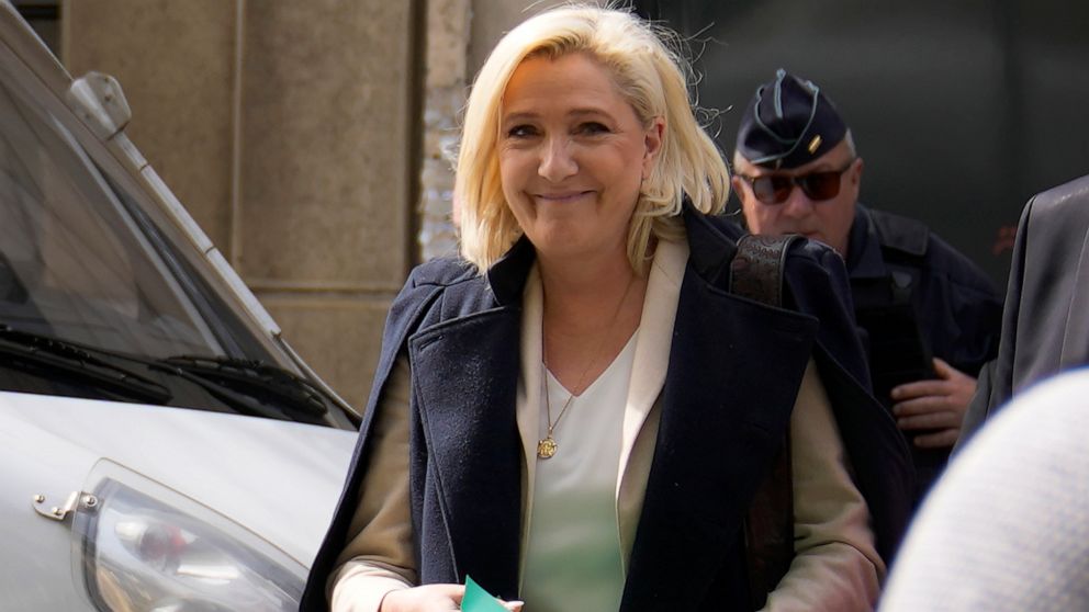 FILE - French far-right candidate Marine Le Pen leaves her campaign headquarters in Paris, Monday, April 11, 2022. French President Emmanuel Macron, the incumbent president with strong pro-European views, and Marine Le Pen, an anti-immigration nation