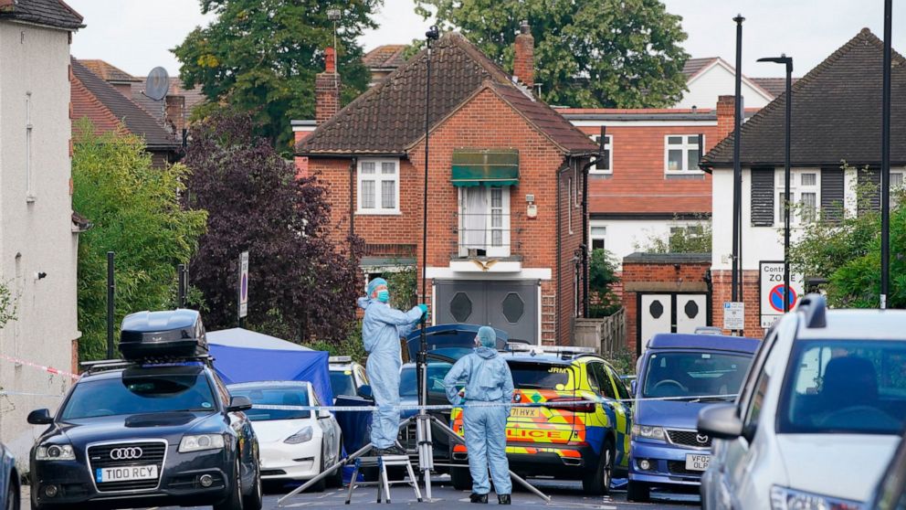 Forensics officers at the scene in Kirkstall Gardens, where a man was shot by armed officers from the Metropolitan Police, following a pursuit on Monday evening, in Streatham Hill, south London, Tuesday, Sept. 6, 2022. (Jonathan Brady/PA via AP)