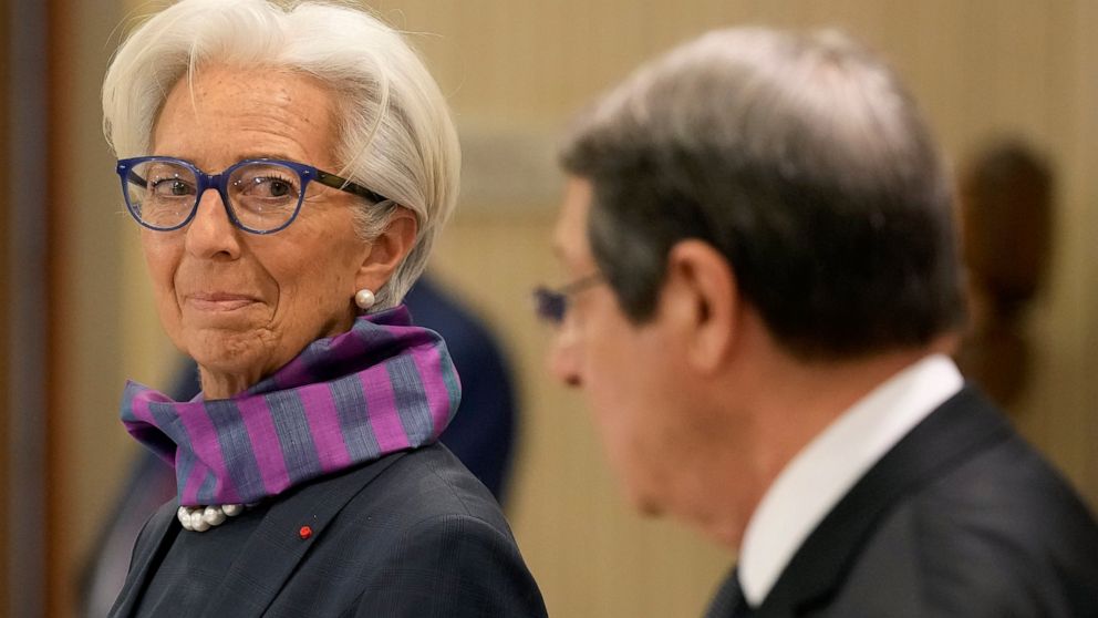 President of the European Central Bank Christine Lagarde looks the Cyprus President Nicos Anastasiades during a press conference after their meeting at the Presidential Palace in the capital Nicosia, Cyprus, Wednesday, March 30, 2022. Lagarde is visi