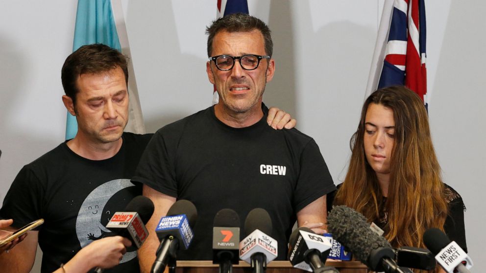 Laurent Hayez, center, father of missing Belgian backpacker Theo Hayez is joined by JP Hayez, godfather, left, and Lisa Hayez, cousin, during a public appeal for information regarding his son's disappearance, at a police station in Tweed Heads, New S