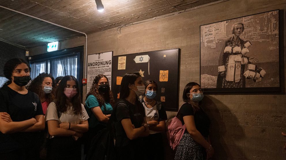 Israeli students visit at the museum "From Holocaust to Revival" on the eve of Holocaust Remembrance Day, in Kibbutz Yad Mordechai, Israel, Wednesday, April. 7, 2021. Holocaust remembrance day is one of the most solemn on Israel's calendar with resta