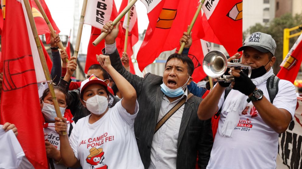 Supporters of Free Peru party presidential candidate Pedro Castillo cheer at his closing campaign rally in Lima, Peru, Thursday, June 3, 2021. Amid protests and corruption allegations, the South American country cycled through three presidents in Nov