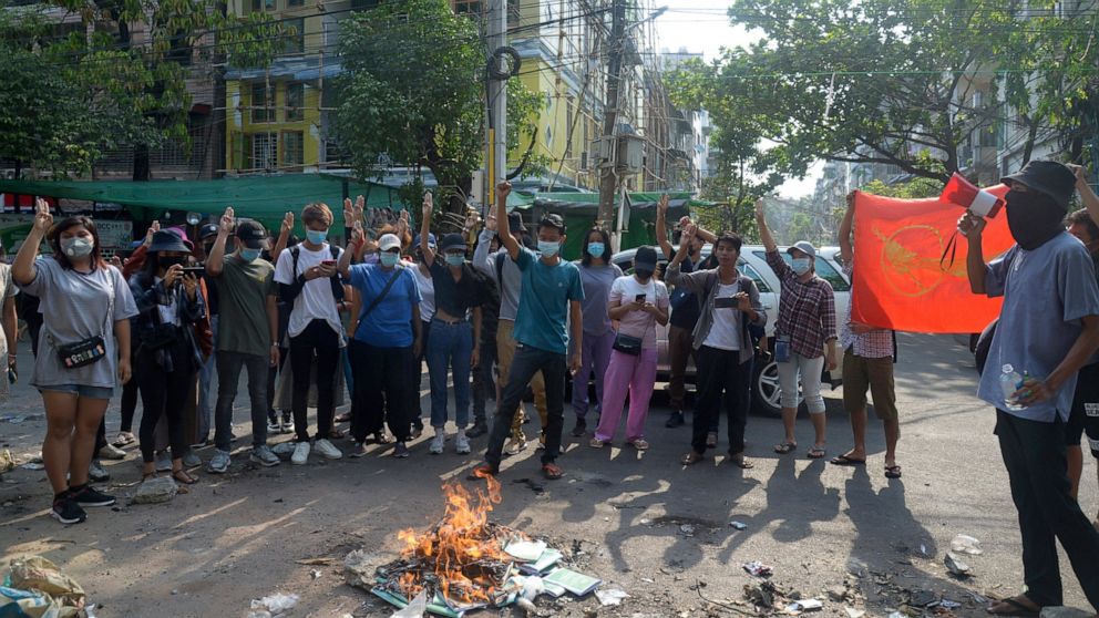 Anti-coup protesters burn constitution books at Tarmwe township in Yangon, Myanmar Thursday April 1, 2021. Opponents of Myanmar’s military government declared the country’s 2008 constitution void and put forward an interim replacement charter late We