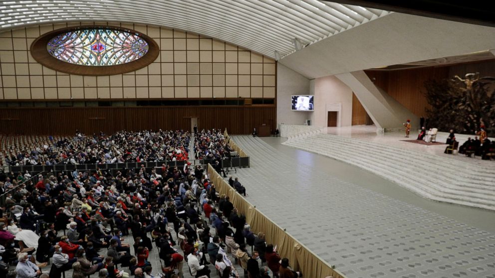 Faithful gather in the Paul VI hall during Pope Francis weekly general audience at the Vatican, Wednesday, Oct. 21, 2020. The Vatican is putting an end to Pope Francis’ general audiences with the public amid a surge in coronavirus cases in Italy and 