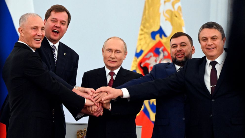 FILE - From left, Moscow-appointed head of Kherson Region Vladimir Saldo, Moscow-appointed head of Zaporizhzhia region Yevgeny Balitsky, Russian President Vladimir Putin, center, Denis Pushilin, leader of self-proclaimed of the Donetsk People's Repub