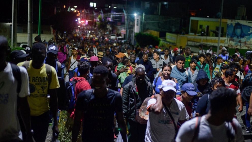 Migrants depart early in the morning from Tapachula, Chiapas state, Mexico, Saturday Oct. 12, 2019. Migrants from Africa, Cuba, Haiti, and other Central American countries set off early morning by foot from Tapachula to the southern border of the Uni