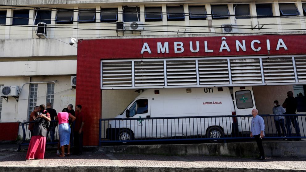 People wait outside the Getulio Vargas Hospital for the arrival of people who were injured or killed during a police raid in the Vila Cruziero favela of Rio de Janeiro, Brazil, Tuesday, May 24, 2022. Police in Rio de Janeiro raided the Vila Cruzeiro 