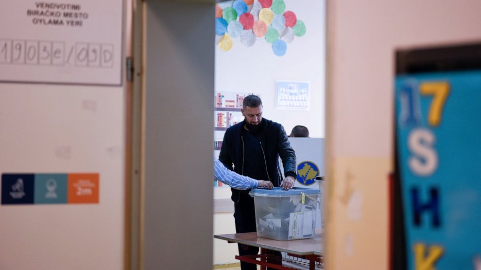 A man casts his ballot at a polling station in Pristina, Kosovo, Sunday, Oct. 17, 2021. Kosovo is holding municipal elections Sunday in which the eight-month-old leftwing governing party aims at capturing the capital Pristina's city hall. (AP Photo/V