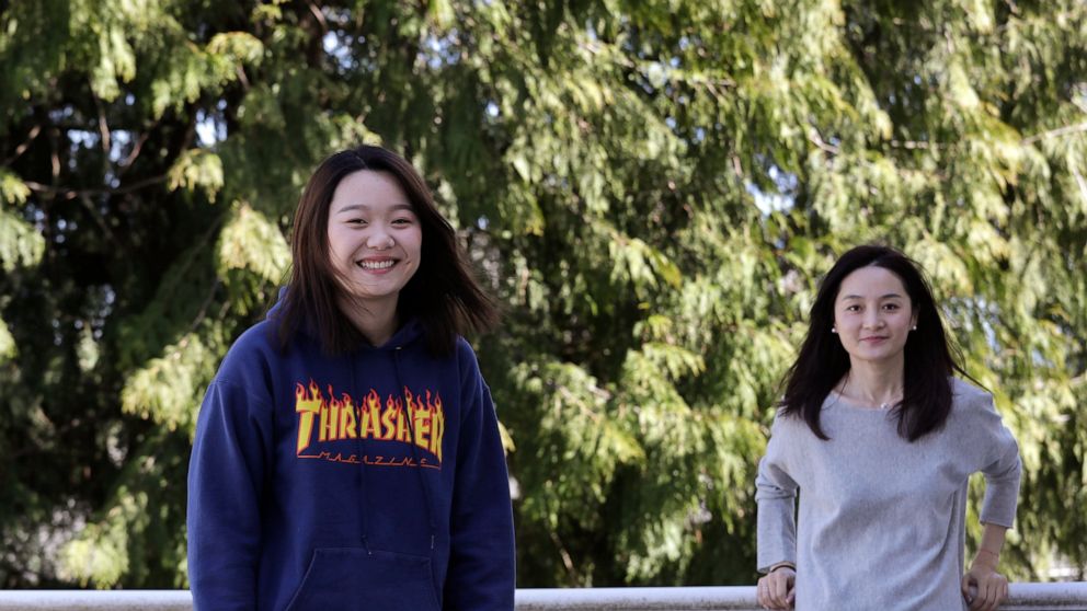 Jodie Chen, right, and her daughter, Mandy Luo, pose for a portrait at their home in Issaquah, Wash., on Monday, April 13, 2020. After being away from her daughter for three years, Chen arrived days earlier from China and is self-quarantining at home
