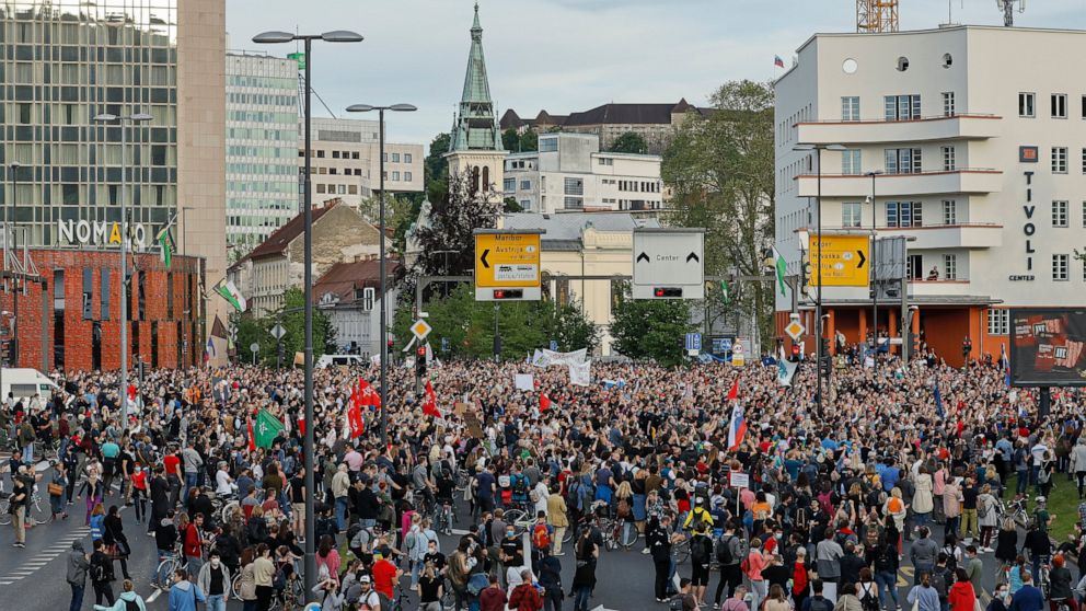 Protesters gather in downtown Ljubljana, Slovenia, Friday, May 28, 2021. Some thousands of people on Friday rallied against Slovenia's right-wing Prime Minister Janez Jansa, reflecting mounting political pressure on the government weeks before the co