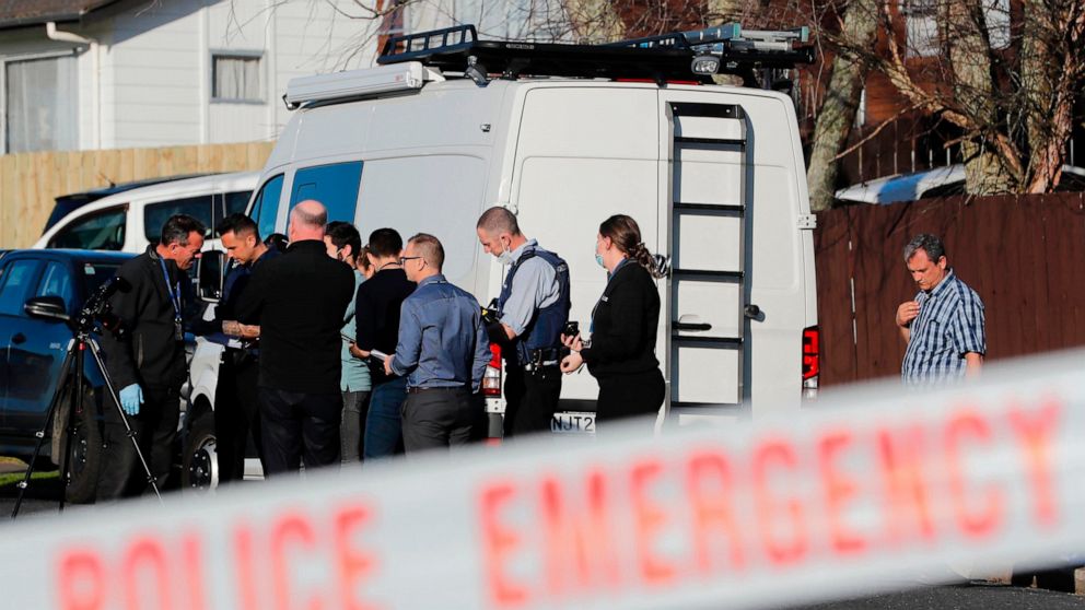 New Zealand police investigators work at a scene in Auckland on Aug. 11, 2022, after bodies were discovered in suitcases. A family who bought some abandoned goods from a storage unit in an online auction found the bodies of two young children conceal