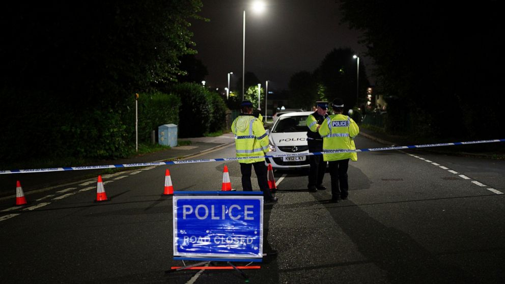 A police cordon on Royal Navy Avenue, near the scene of an incident in the Keyham area of Plymouth, southwest England, Thursday, Aug. 12, 2021. Police in southwest England said several people were killed, including the suspected shooter, in the city 