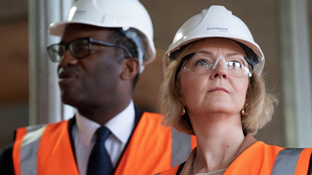 Britain's Prime Minister Liz Truss, foreground and Chancellor of the Exchequer Kwasi Kwarteng look on, during a visit to a construction site for a medical innovation campus, on day three of the Conservative Party annual conference at the Internationa