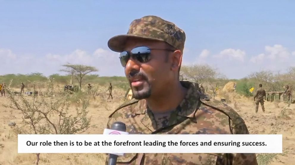 In this image made from undated subtitled video released by the prime minister of Ethiopia, Abiy Ahmed is seen dressed in military uniform speaking to a television camera at an unidentified location in Ethiopia. A state-affiliated broadcaster and the