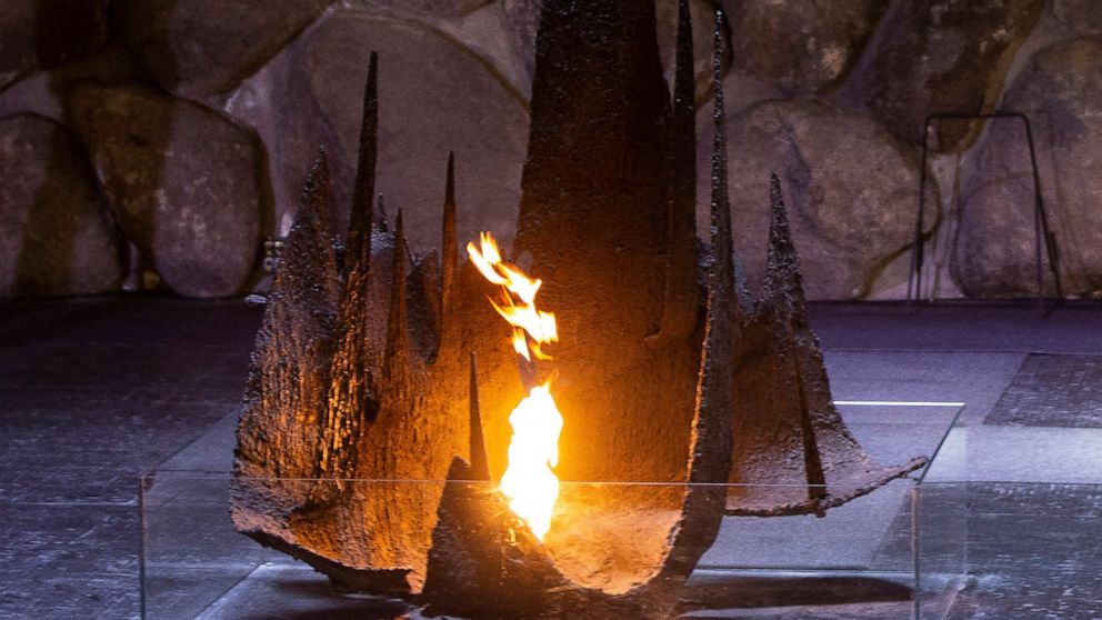 FILE - The Eternal Flame glows in the Hall of Remembrance at the Yad Vashem Holocaust Museum in Jerusalem, Wednesday, June 16, 2020. Israeli researchers say the coronavirus pandemic and the Israel-Gaza war fueled a spike in antisemitism around the wo