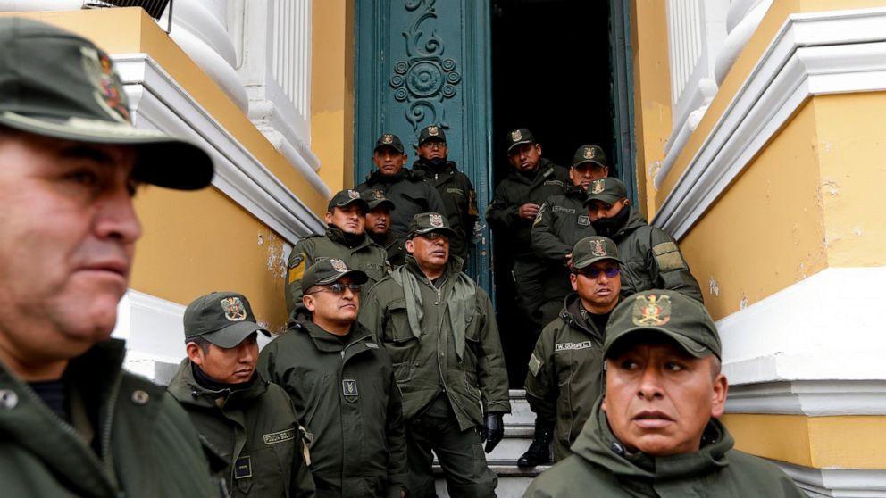Police guard Congress in La Paz, Bolivia, Monday, Nov. 11, 2019. Bolivian President Evo Morales' Nov. 10 resignation, under mounting pressure from the military and the public after his re-election victory triggered weeks of fraud allegations and dead