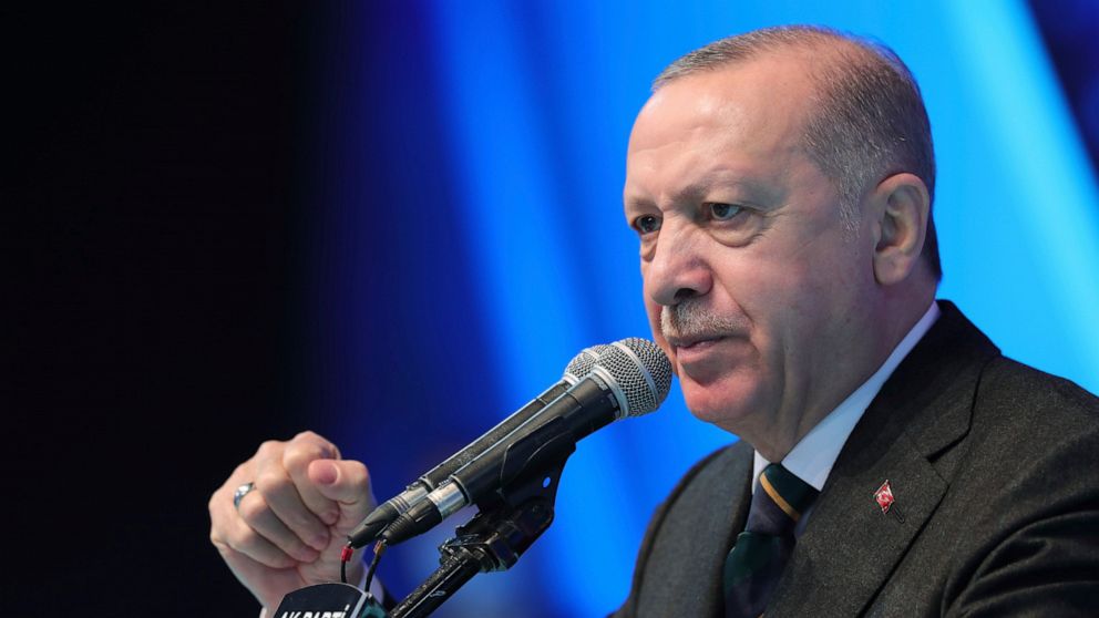 FILE - In this file photo dated Wednesday, March 24, 2021, Turkey's President Recep Tayyip Erdogan gestures as he delivers a speech during his ruling party's congress inside a packed sports hall in Ankara, Turkey. Libya's visiting interim prime minis