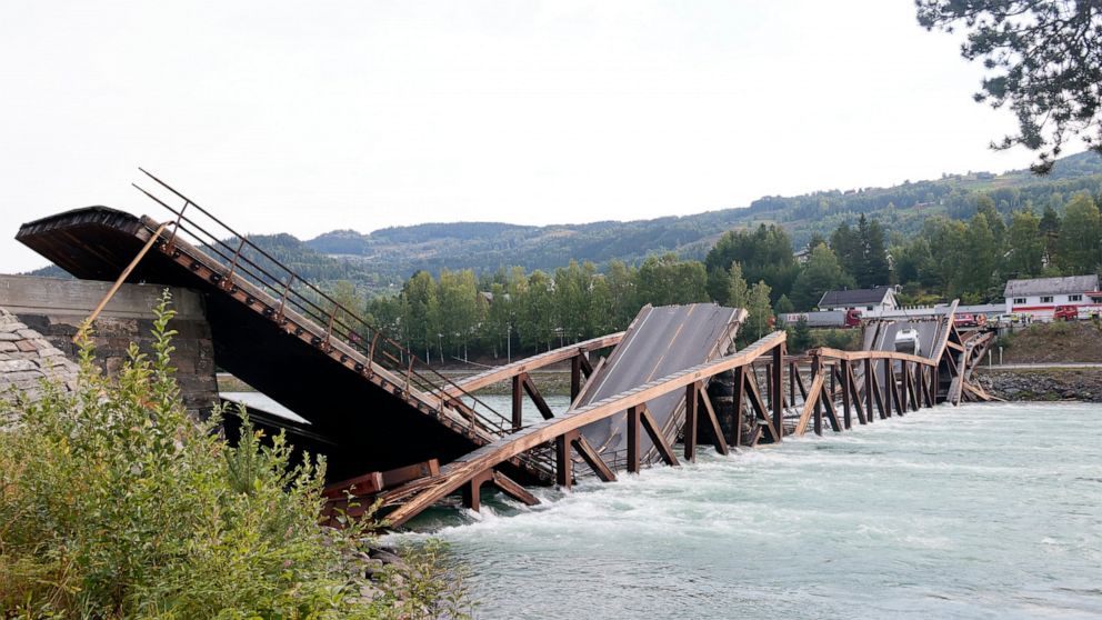 FILE - A view of a bridge that has collapsed over the River Laagen, in Gudbrandsdalen, Norway, Monday, Aug. 15, 2022. A preliminary investigation into the collapse of a wooden bridge in southern Norway, causing no injuries, has been assessed to have 