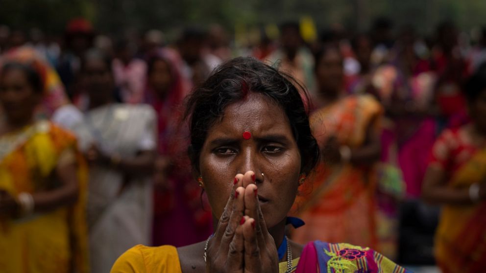 A tribes woman prays during a sit-in demonstration rally to demand of recognizing Sarna Dharma as a religion in Ranchi, capital of the eastern Indian state of Jharkhand, Oct. 18, 2022. Tribal groups have held protests in support of giving Sarna Dharm