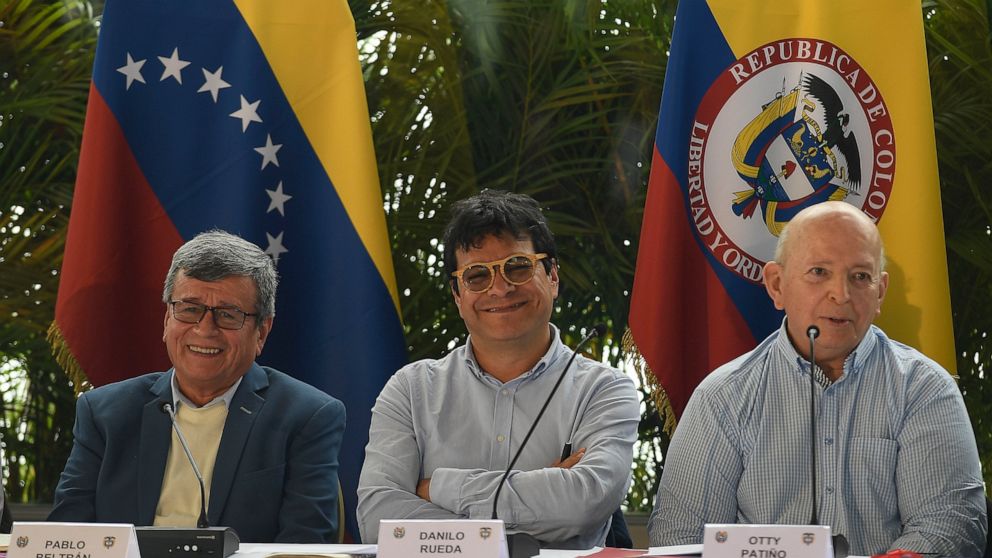 Pablo Beltran, left, representing the Colombian guerrilla National Liberation Army (ELN), Ivan Danilo Rueda, High Commissioner for Peace on behalf of the Colombian government, center, and Otty Pantino, of the Colombian government delegation, attend a