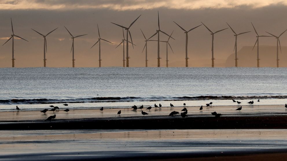 UK eases ban on new wind farms, considers OKing coal mine