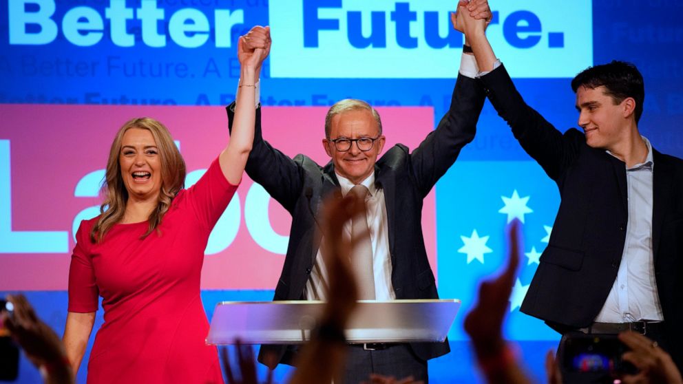 FILE - Labor Party leader Anthony Albanese, center, celebrates with his son Nathan, right, and his partner Jodie Haydon at a Labor Party event in Sydney, Australia, on May 22, 2022, after then Prime Minister Scott Morrison conceding defeat to Albanes