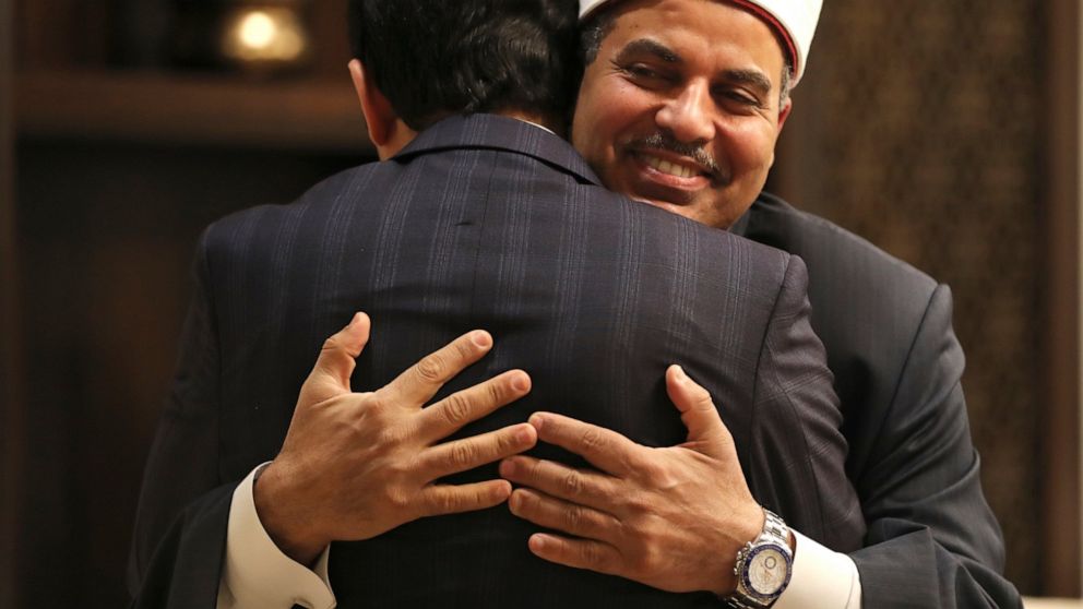 Prof. Mohamed Hussein El-Mahrassawy, President of Al-Azhar University, right, hugs Judge Mohamed Mahmoud Abdel Salam, former advisor to the Grand Imam of Al-Azhar, at a roundtable discussion in Abu Dhabi, United Arab Emirates, Monday, Feb. 3, 2020. I