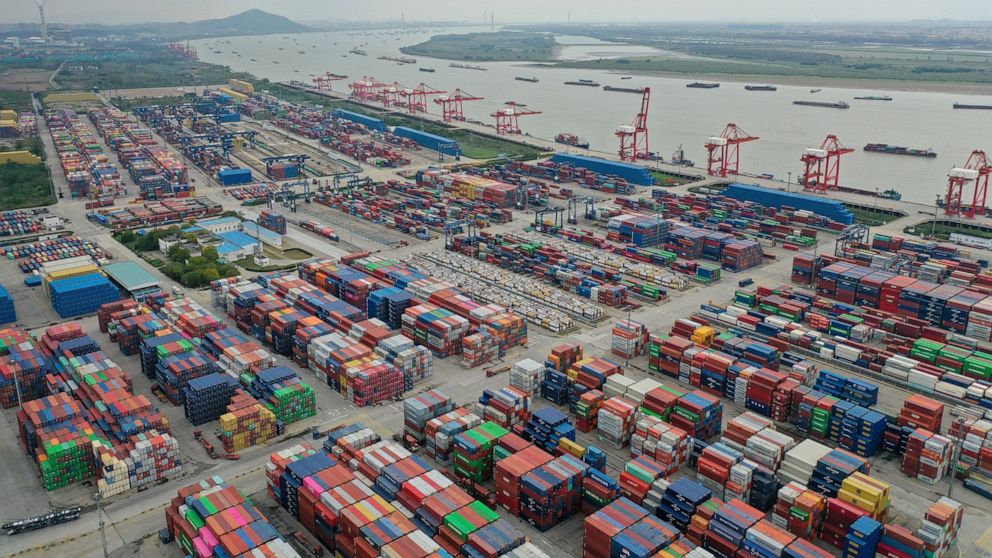 FILE - Containers are seen at a port in Nanjing in eastern China's Jiangsu province on Oct. 27, 2022. China’s imports and exports shrank in November as global demand weakened and anti-virus controls weighed on the second-largest economy. (Chinatopix 