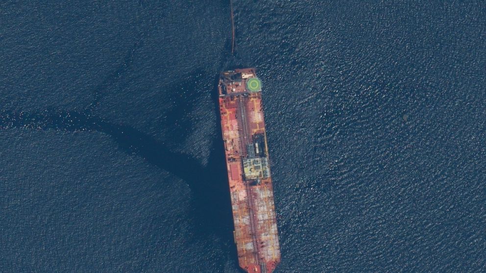 This satellite image released by Maxar Technologies shows the FSO Nabarima oil tanker off the coast of Trinidad and Tobago, Sunday, Aug. 9, 2020. The oil tanker listing off a remote Venezuelan coastline is triggering international calls for action. C