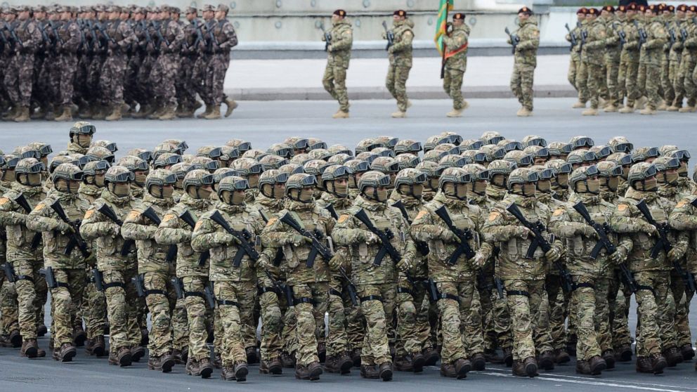 Azerbaijani troops march past during a parade in Baku, Azerbaijan, Thursday, Dec. 10, 2020. A military parade has been held in the Azerbaijani capital in celebration of a peace deal with Armenia over Nagorno-Karabakh that saw Azerbaijan reclaim much 
