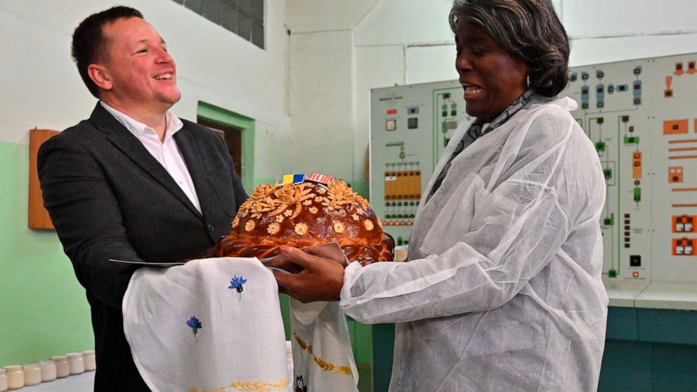 U.S. ambassador to the United Nations, Linda Thomas-Greenfield, right, is welcomed during her visit to the Kyiv Mlyn flour mill in Kyiv, Tuesday, Nov. 8, 2022. Thomas-Greenfield, reassured Ukrainian farmers Tuesday that it was a priority for the Secr