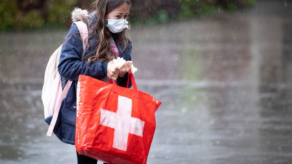 Swiss vote on COVID law amid sharp rise in infections