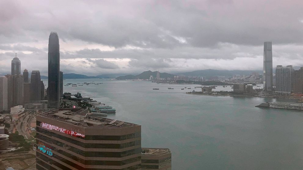 Storm clouds form over the harbor in Hong Kong, Wednesday, Nov. 2, 2022. Severe tropical storm Nalgae edged closer to Hong Kong on Wednesday and forced businesses to close, but the finance summit that's meant to restore the city's image as an interna