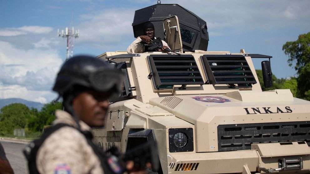 Police officers in an armored vehicle patrol the Varreux fuel terminal in Port-au-Prince, Haiti, Monday, Nov. 7, 2022. Authorities seemed to have gained control of the key fuel terminal a day after a powerful gang leader announced that he was lifting