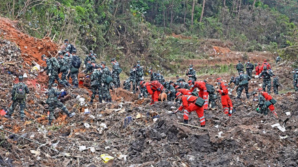 Terrain, rain hampering search at site of China plane crash