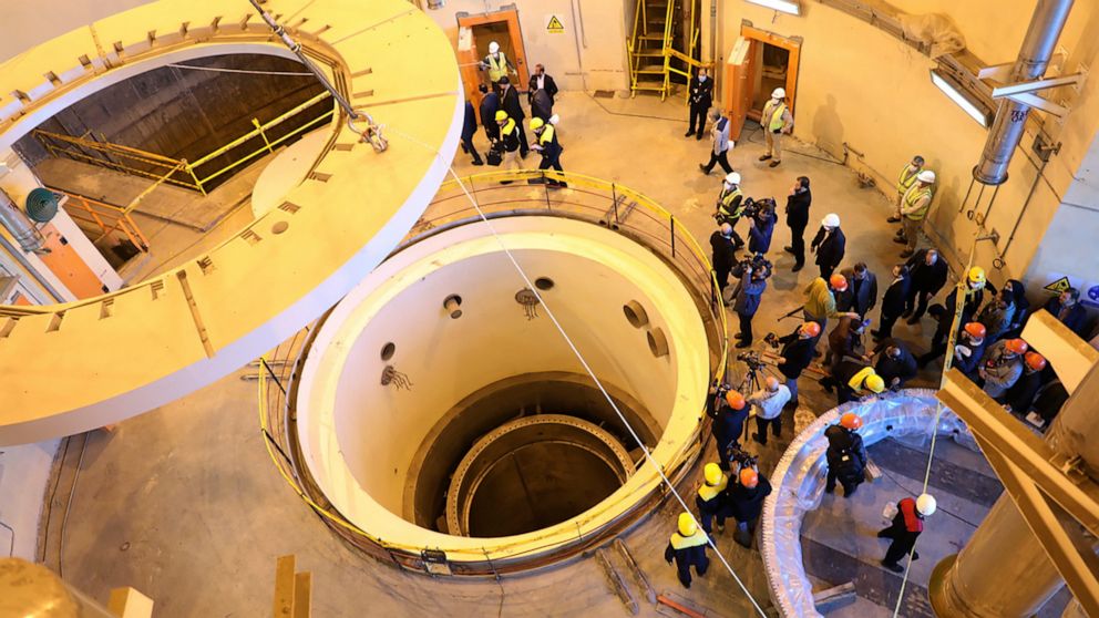 FILE - In this photo released by the Atomic Energy Organization of Iran, technicians work at the Arak heavy water reactor's secondary circuit, as officials and media visit the site, near Arak, Iran, Dec. 23, 2019. The United Nations’ atomic watchdog 