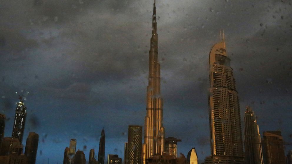 FILE - In this Nov. 26, 2018 file photo, sunlight reflects off the Burj Khalifa, the world's tallest building, during a rain shower in Dubai, United Arab Emirates. For eager Israelis, anticipation is mounting that Dubai’s glitzy Burj Khalifa, will so