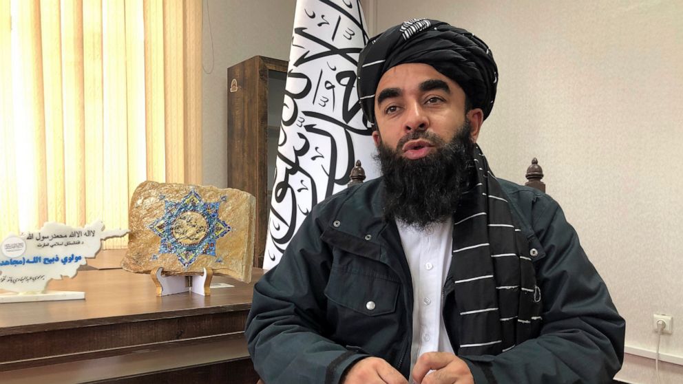 Taliban government spokesman Zabihullah Mujahid speaks during an interview with the Associated Press in Kabul, Afghanistan, Saturday, Jan. 15, 2022. Afghanistan's Taliban rulers are aiming to restart education for girls and women by late March, the g