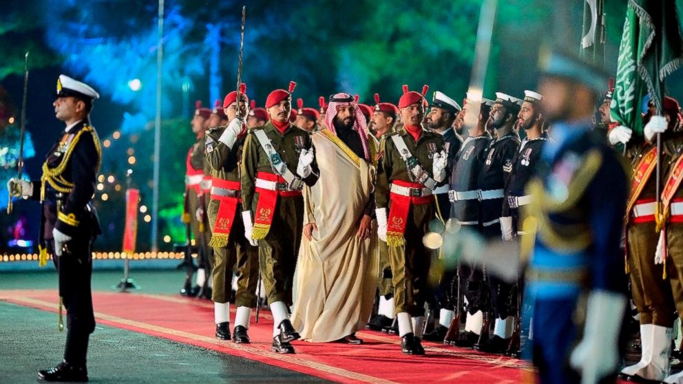 In this photo released by the Press Information Department, visiting Saudi Arabia's Crown Prince Mohammed bin Salman, center, reviews guard of honour during a welcoming ceremony in Islamabad, Pakistan, Sunday, Feb. 17, 2019. Saudi Arabia's powerful C