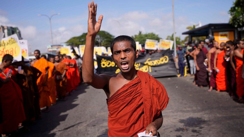 A student monk representing Inter University Students Federation shouts slogans during an anti government protest in Colombo, Sri Lanka, Thursday, May 19, 2022. Sri Lankans have been protesting for more than a month demanding the resignation of Presi