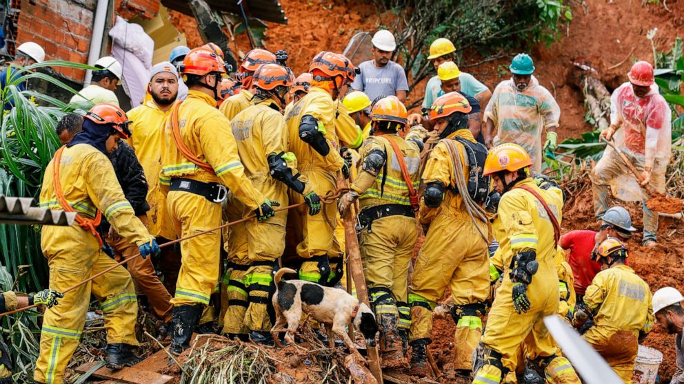 Firefighters search for landslide victims after heavy rains in Franco da Rocha, Sao Paulo state, Brazil, Monday, Jan 31, 2022. At least 19 people have died in cities in the interior of Brazil's largest state, Sao Paulo, after landslides caused by hea