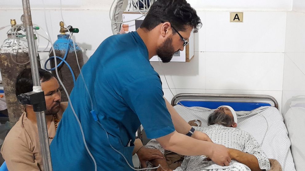 A wounded man receives treatment in a hospital, after a bombing at a mosque in the town of Imam Saheb, in Kunduz Province in north of Kabul, Afghanistan, Friday, April 22, 2022. A Taliban official says a bombing at a mosque and religious school in no