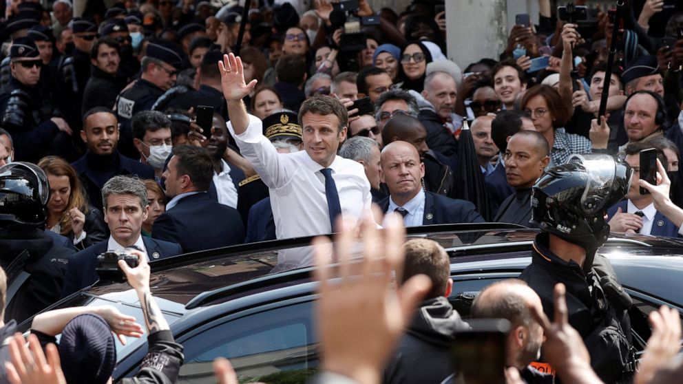 Fruity near-miss for France's Macron, targeted by tomatoes