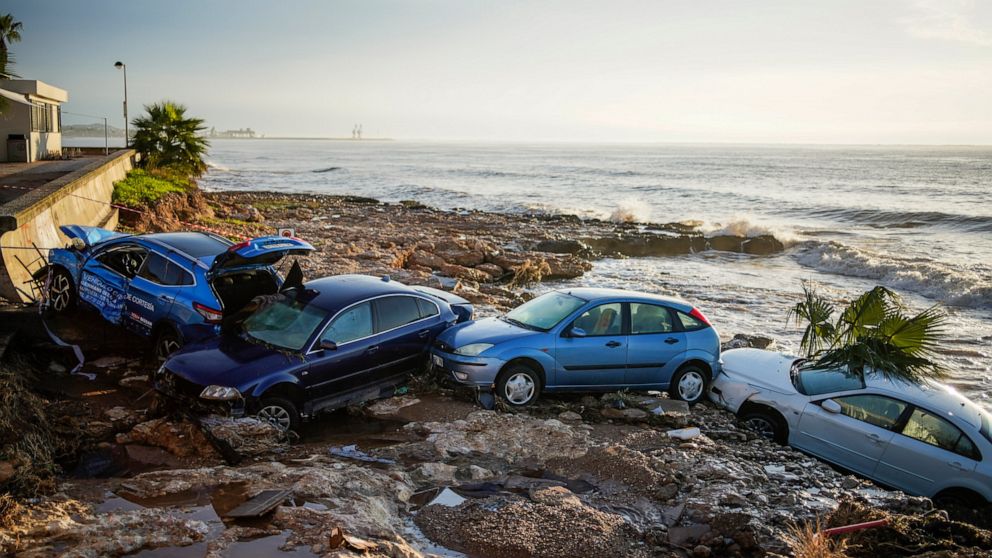 Floods sweep cars into sea, damage homes in northeast Spain