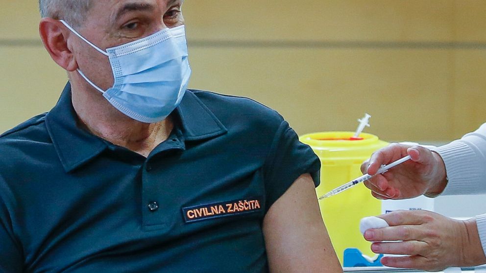 In this Friday, March 26, 2021 file photo, Slovenia's Prime Minister Janez Jansa is given a COVID-19 vaccine in Ljubljana, Slovenia. Slovenia takes over the European Union presidency with its Prime Minister in the focus because of his squabbles with 
