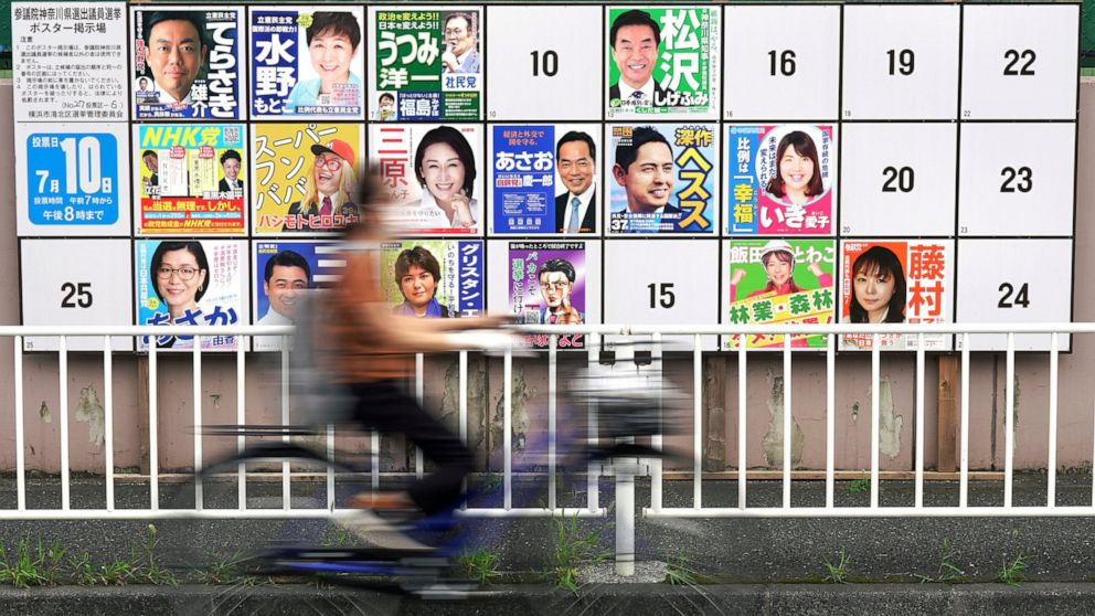 Local campaign poster bulletin board for upper house election is seen Monday, July 4, 2022, in Yokohama, near Tokyo. Ahead of Sunday's parliamentary elections, nearly a dozen opposition parties are trying to topple the Liberal Democratic Party, which